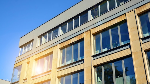 Glass building with transparent facade of the building and blue sky