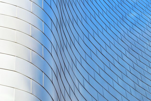 Glass building with transparent facade of the building and blue sky