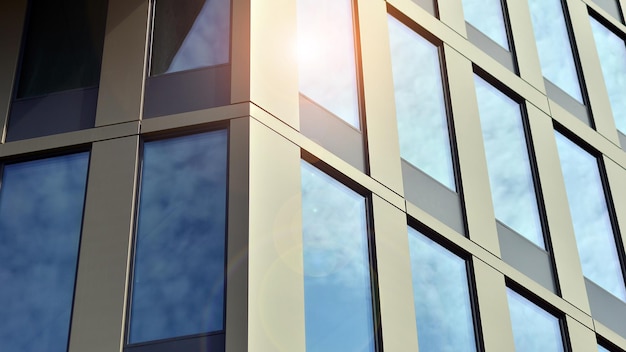 Glass building with transparent facade of the building and blue sky