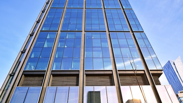 Glass building with transparent facade of the building and blue sky