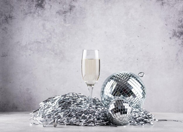 Glass of champagne with disco ball