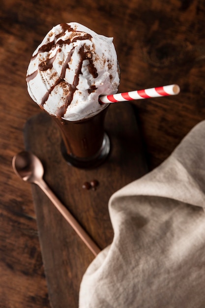 Glass of chocolate shake on table