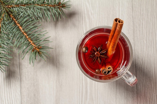 Glass of Christmas mulled wine with cinnamon star anise and cloves
