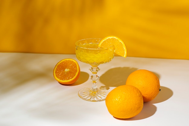 Glass of cocktail or orange juice in the sunlight