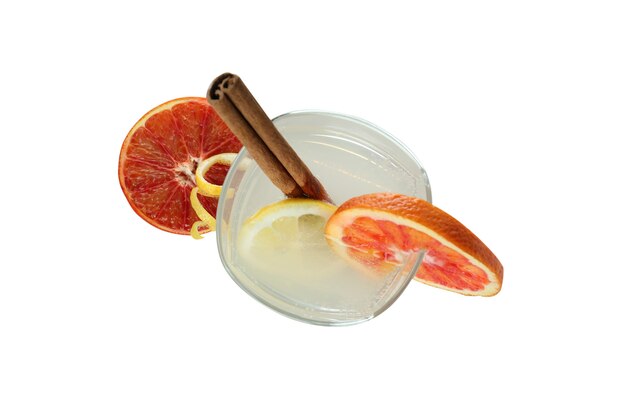 Glass of cocktail with citrus isolated on white surface