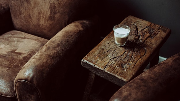 glass of coffee on rustic wooden coffee table