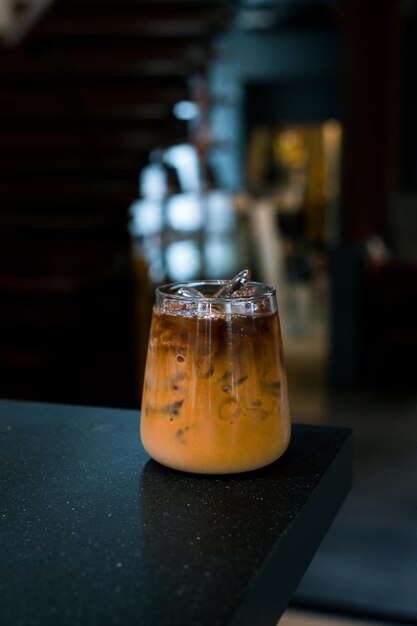 Glass of coffee with milk on the table