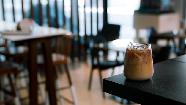 Glass of coffee with milk on the table