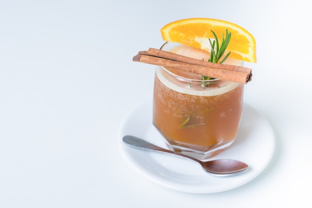 Glass of coffee with orange on white background