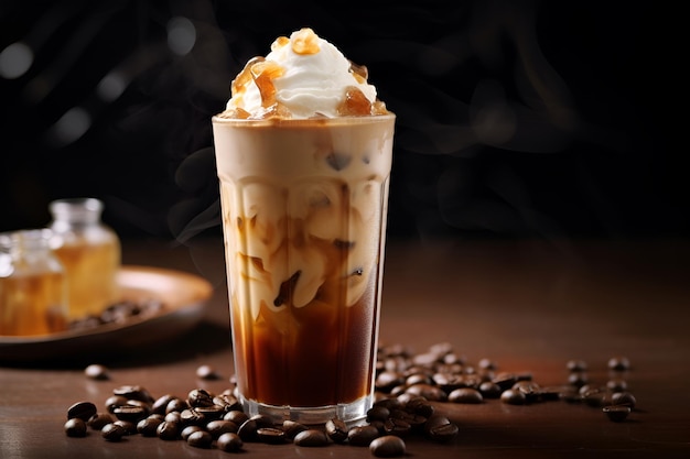 A glass of coffee with whipped cream and coffee beans on the table.