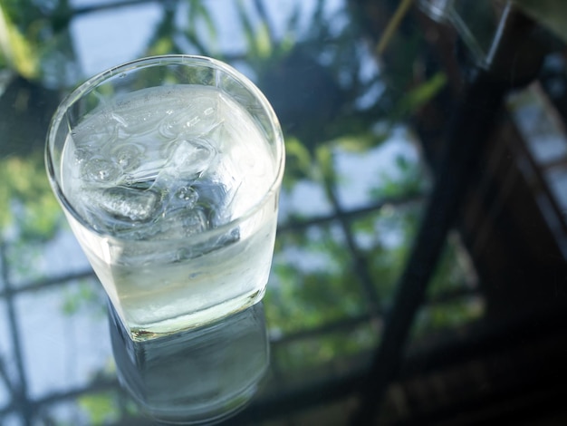 A glass of cold drinking water with ice