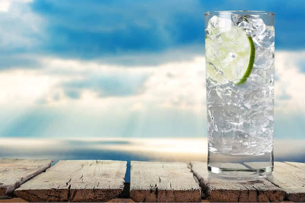 Glass of cold water with slice of lime