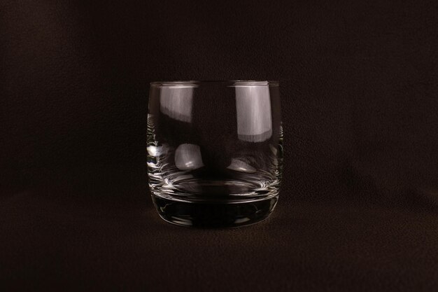 Photo glass cup on a dark brown background