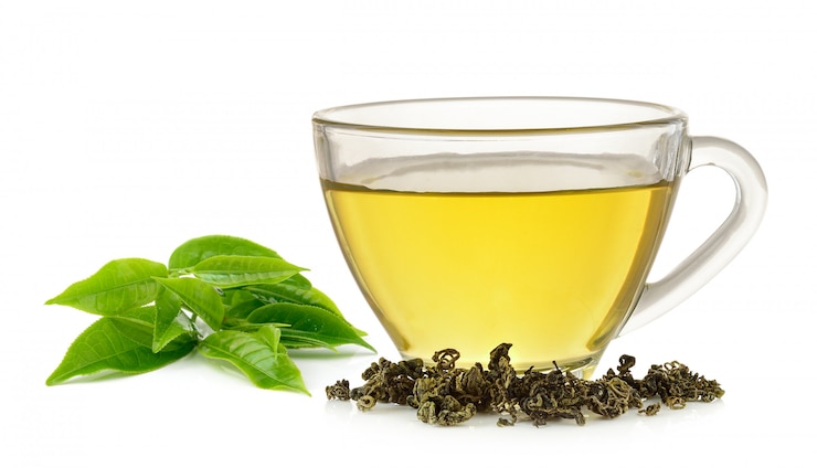 Glass cup of green tea isolated