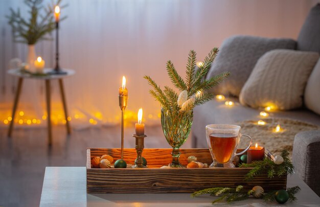 Glass cup of tea with christmas decor at home