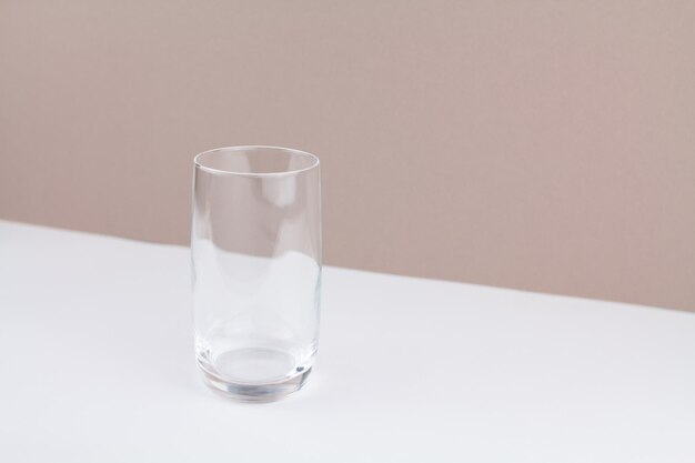 Glass cup on white brown background stylish in the kitchen