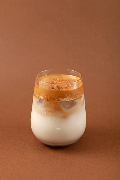 Glass of Dalgona Misugaru Latte. Korean drink made from roasted multi grain powder, milk and coffee.