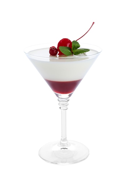 Glass of delicious panna cotta on white