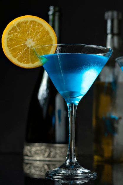 A GLASS OF DINK BLUE DECORATED WITH ORANGE