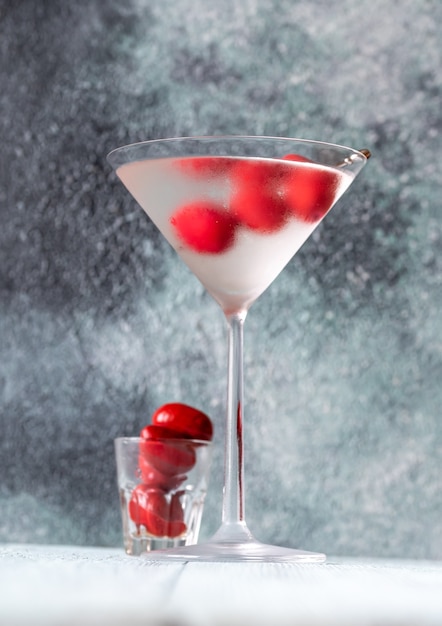 Glass of Dry Martini with red olives