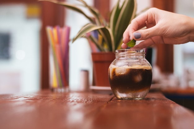 The glass of exotic coffee with ice