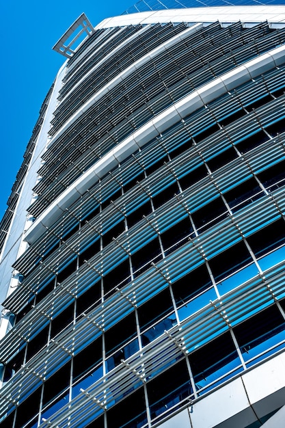 Glass facade of modern office building Glass facade of modern office building Doha business district Business economy and finances concept