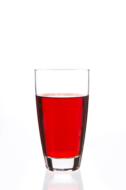 Glass filled with red liquid