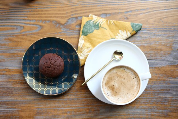 Glass of filter coffee with delicious cookies 