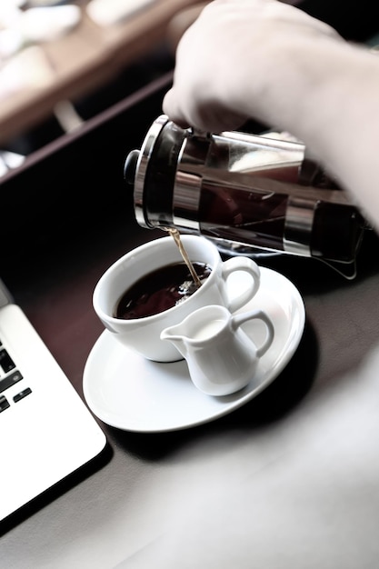 Glass of filter coffee with delicious cookies