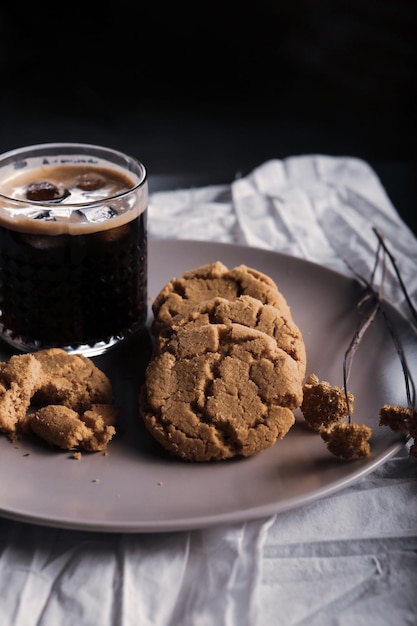 Glass of filter coffee with delicious cookies