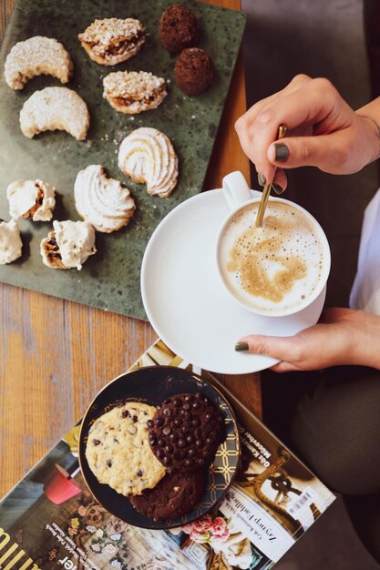 Glass of filter coffee with delicious cookies