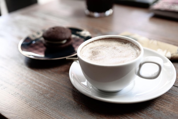 Glass of filter coffee with delicious cookies