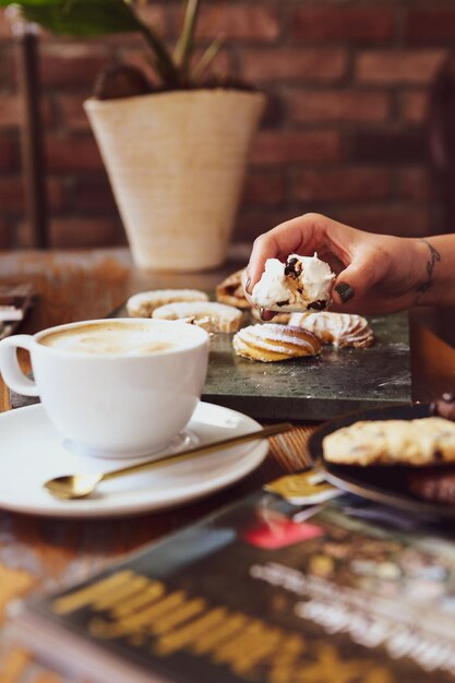 Glass of filter coffee with delicious cookies