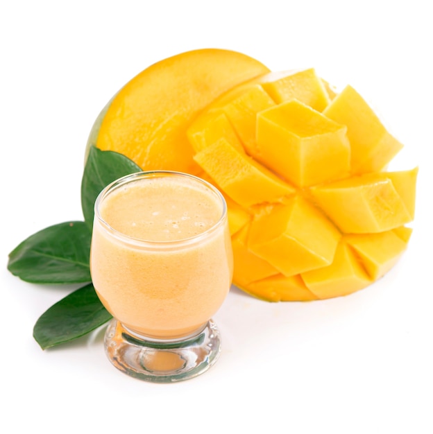 Glass of fresh mango juice. Glass of fresh mango smoothie isolated on white background