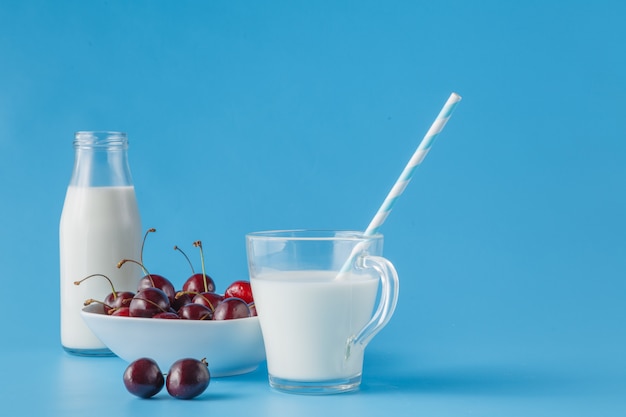 Glass of fresh milk with drinking straw