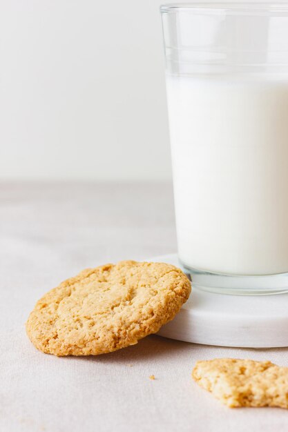 Glass of fresh milk with oatmeal cookies