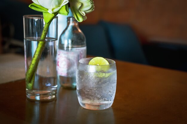 Glass or fresh sparkling mineral water with slice of lime