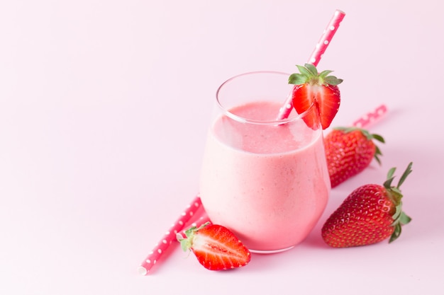 a glass of fresh strawberry smoothie