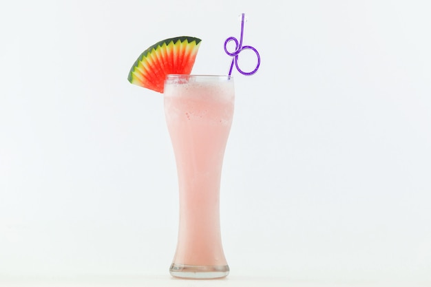 Glass of fresh watermelon smoothie on white background