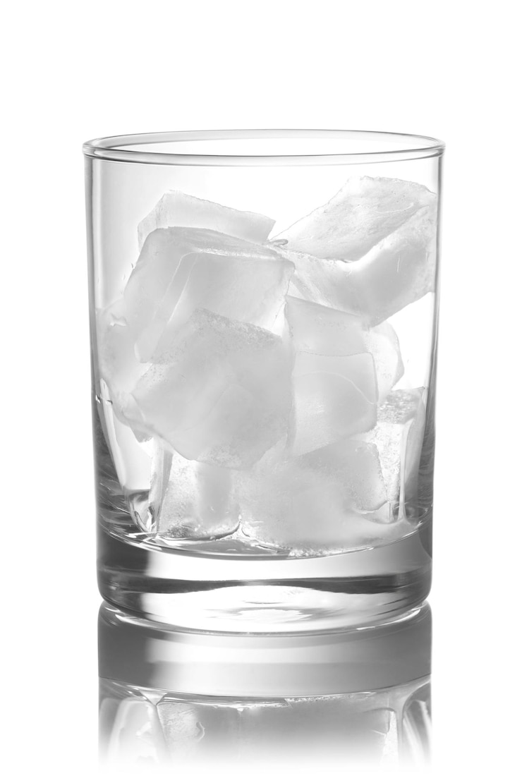 Photo glass full with ice on a white