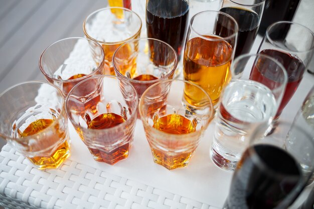 Glass glasses with drinks stand on a table