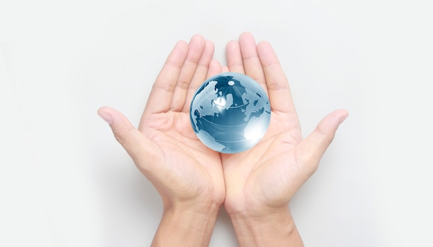Glass globe in hand,Energy saving concept, Elements of this image furnished by NASA