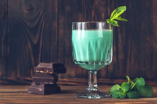 Glass of Grasshopper Cocktail garnished with mint and grated chocolate