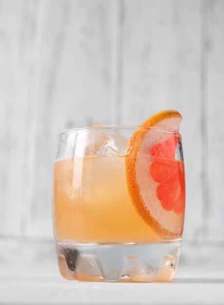 Glass of Great Gatsby Cocktail garnished with orange slice wheel