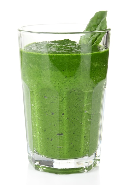 Glass of green vegetable juice with basil isolated on white