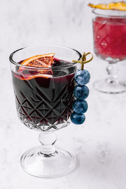 Glass of hot mulled wine with spices