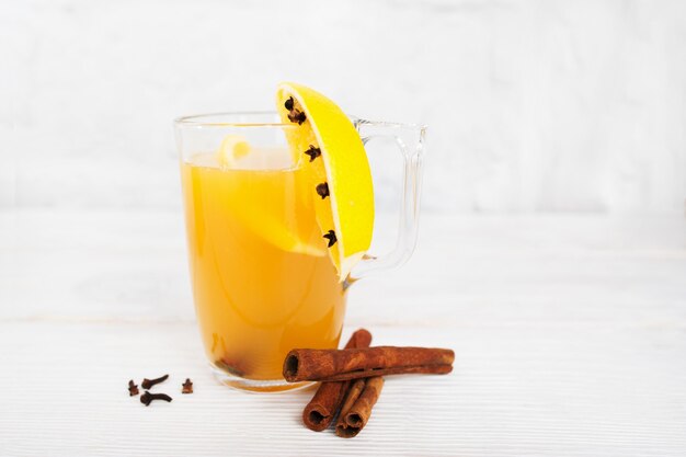 Glass of hot orange cocktail