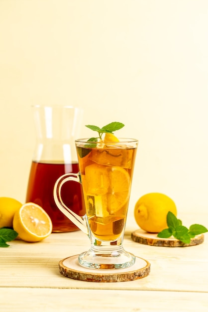 glass of ice lemon tea with mint