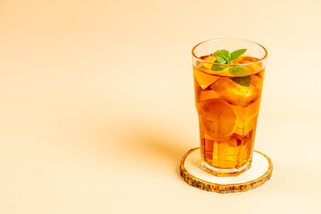 glass of ice lemon tea with mint