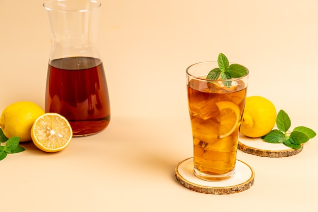 glass of ice lemon tea with mint